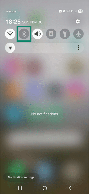 Android home screen with the notifications window swiped down. The "Bluetooth" icon is highlighted.
