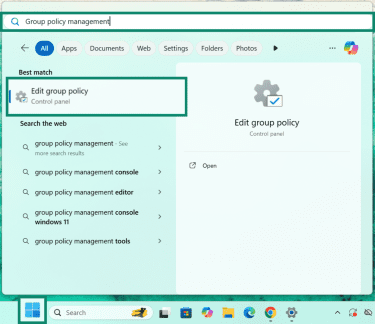 Windows search panel with Edit group policy search result highlighted.